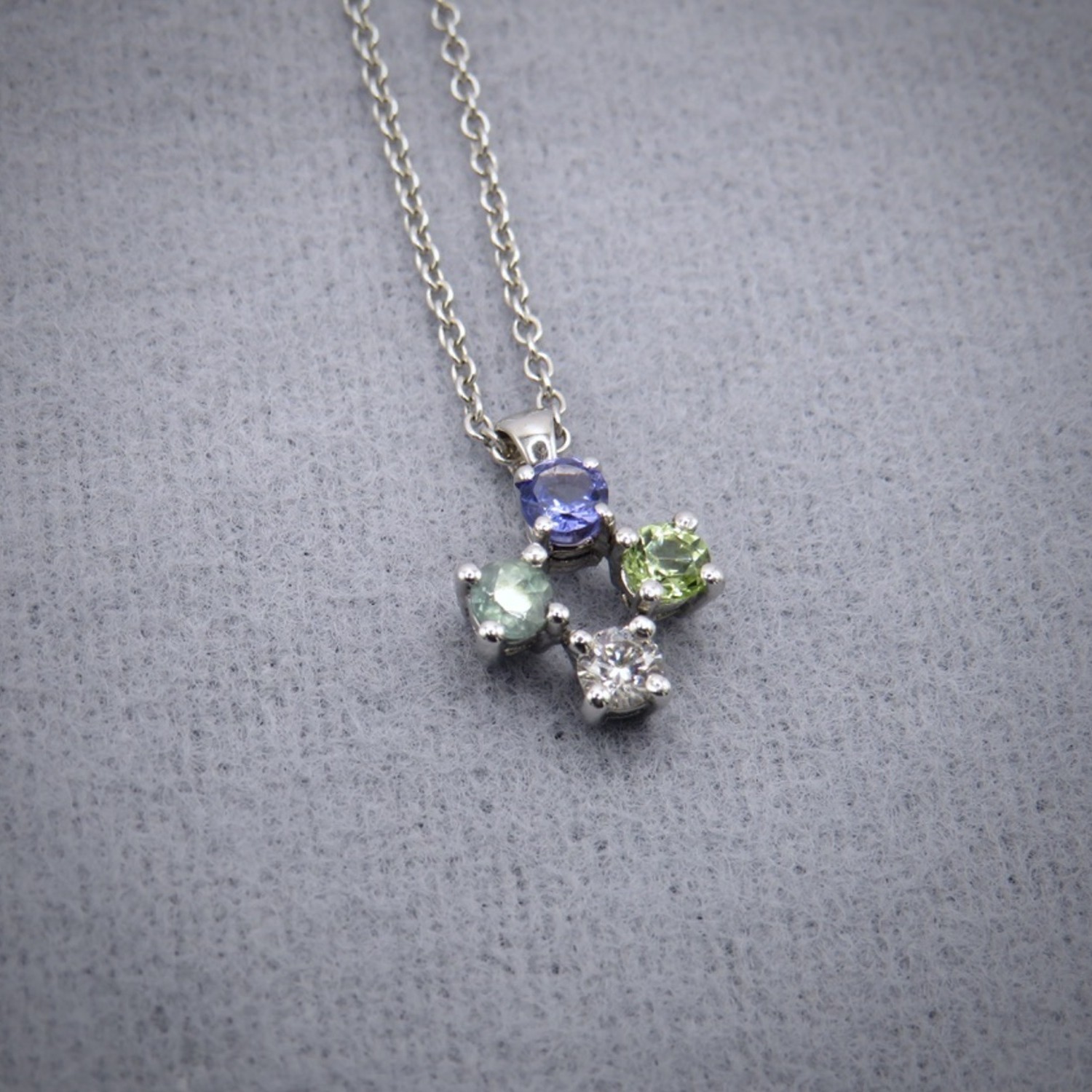 Diamond, alexandrite, peridot and diamond pendant