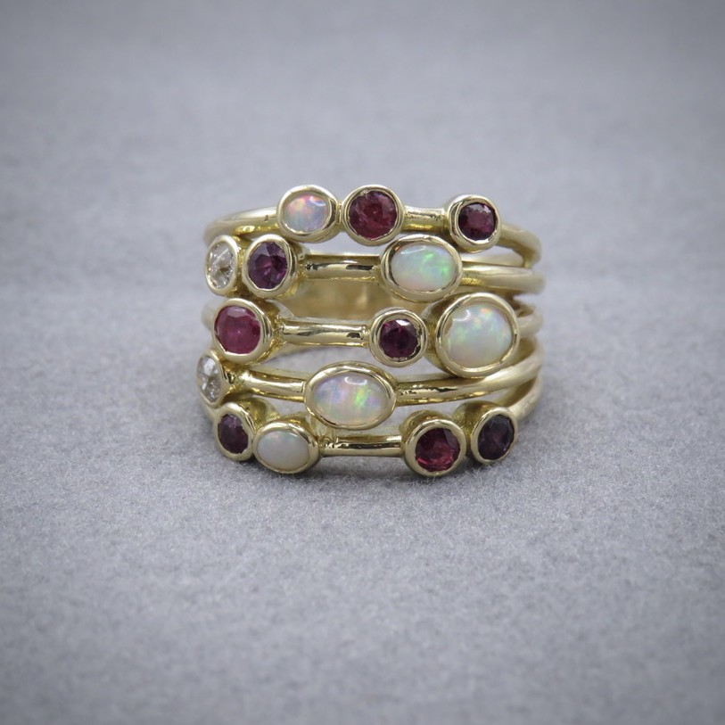 ruby and opal bubble ring in yellow gold across 5 bands