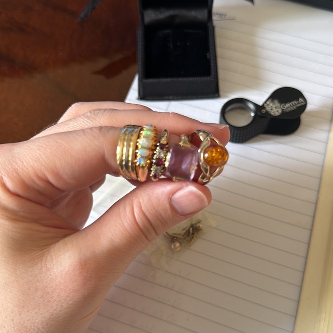 stack of various rings on a finger